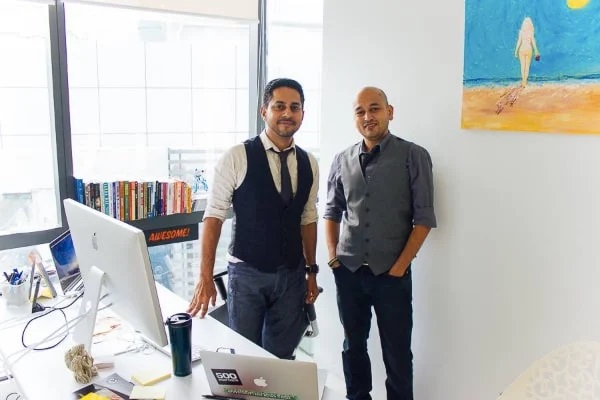 men standing in front of computers