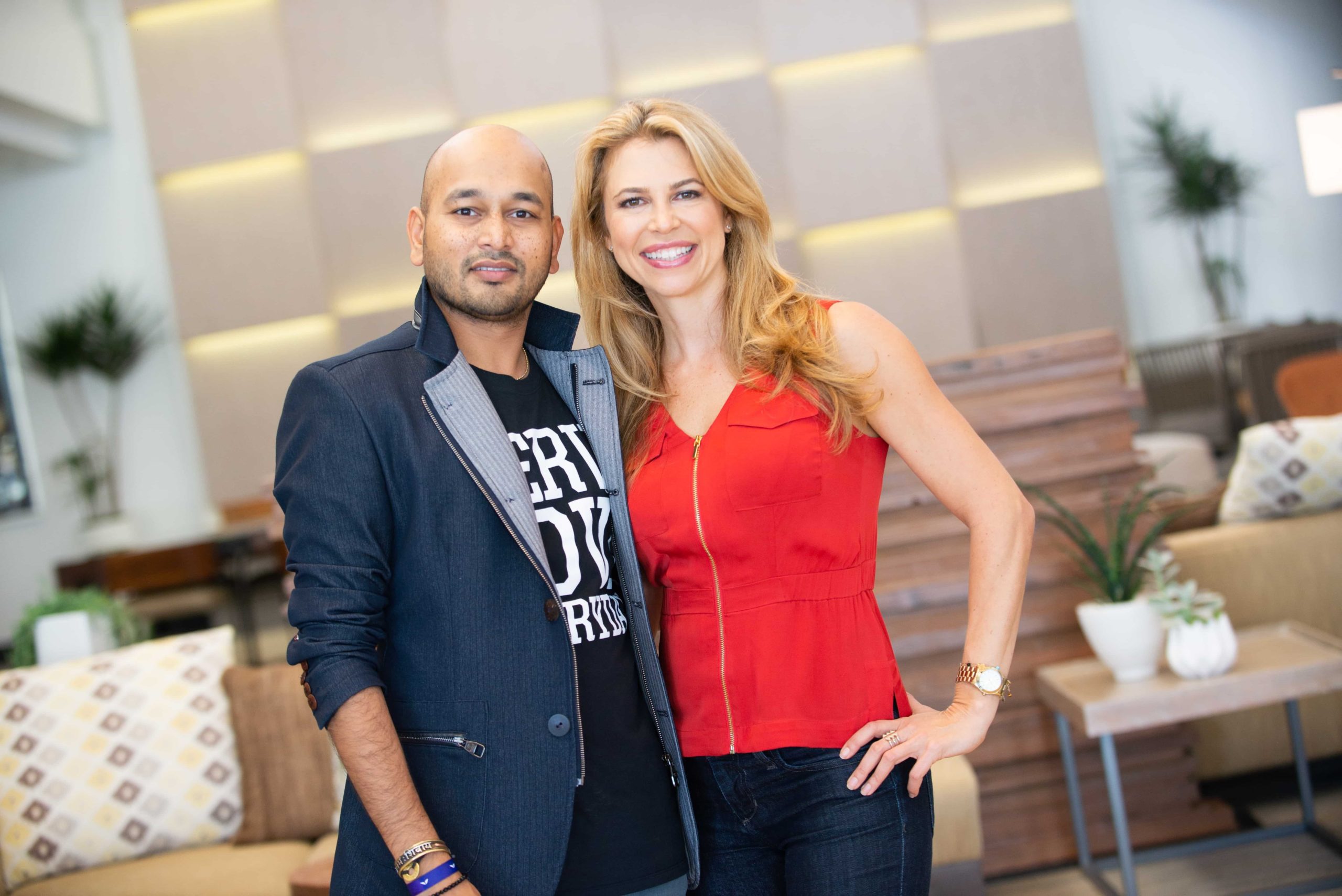 Ajit Nawalkha, Christine Hassler are posing for a picture