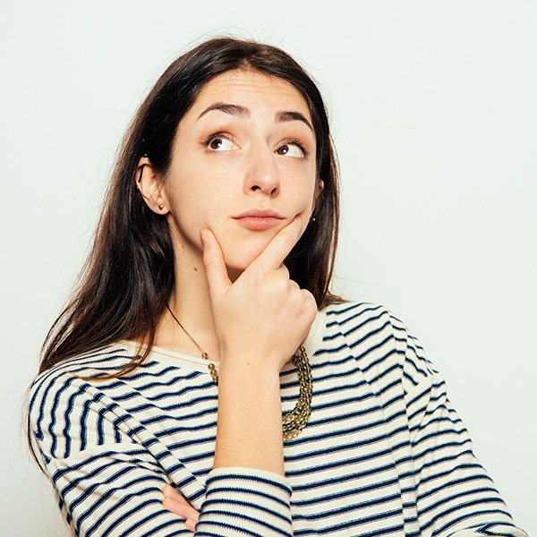 a woman with her hand on her chin