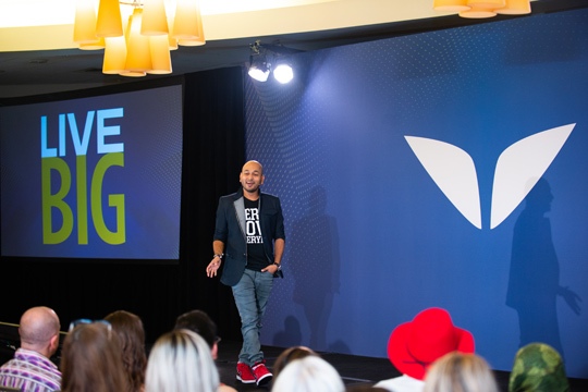 Ajit-speaking-about-the-art-to-LIVE-BIG-in-front-150+-Coaches-at-Evercoach-Summit-2018-in-LA-1- a person standing on a stage
