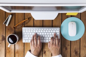 Build Awareness a person's hands on a keyboard